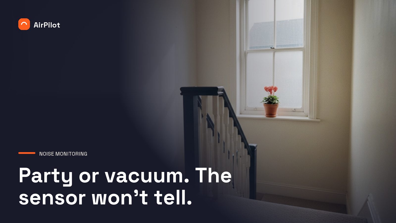 Staircase landing in a UK terraced house with pale carpet, white walls, and afternoon light casting shadows between floors.