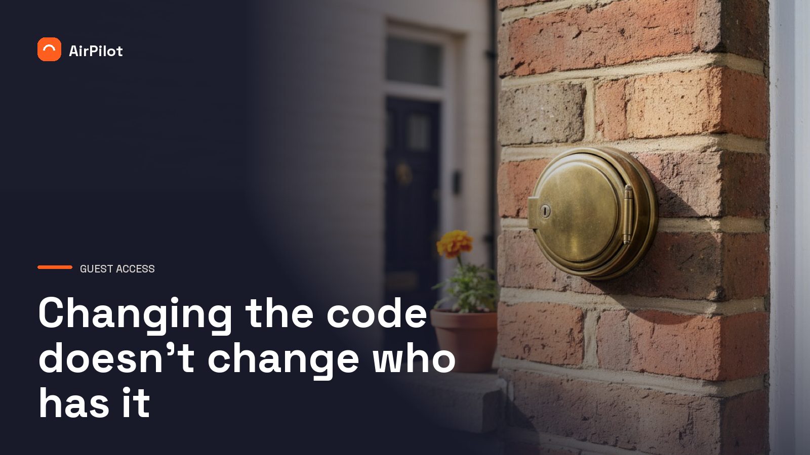 A brass key safe bolted to weathered red brick beside a black front door